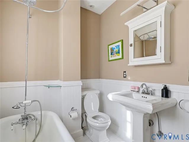 a bedroom with a bed wooden floor and window