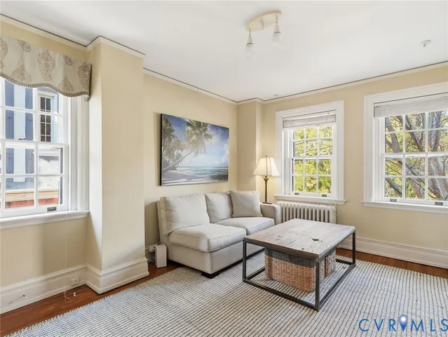 a bedroom with furniture and a book shelf