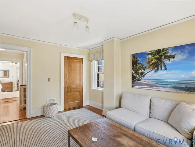a dining room with a table and chairs