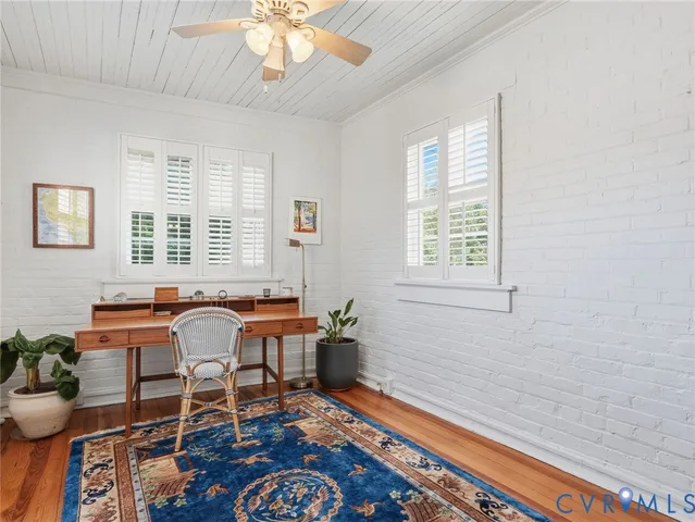 a backyard of a house with outdoor seating