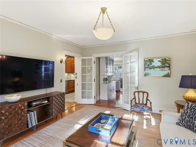 a view of entryway and hall with wooden floor