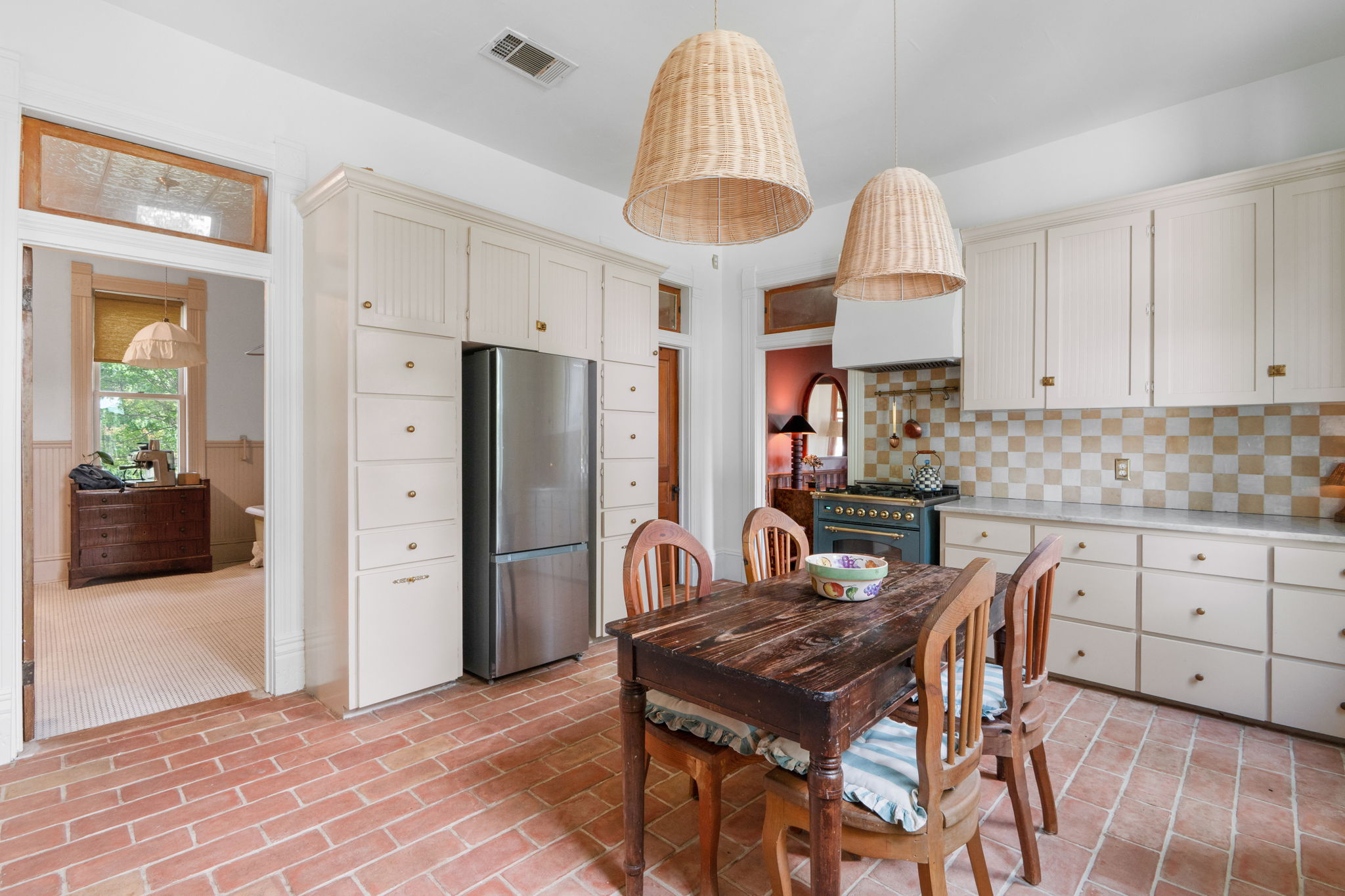 17919 Manda Carlson Road Coupland, TX 78615 - Photo 7 of 40 a kitchen with stainless steel appliances a table chairs refrigerator and cabinets