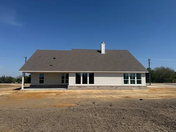 a front view of a house with street view