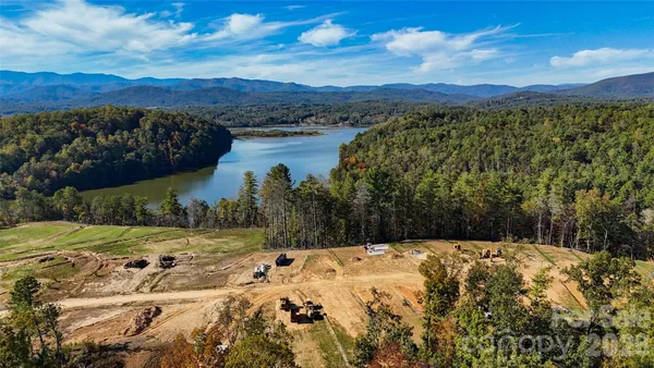 a view of a lake with a yard