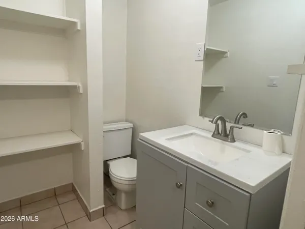 a bathroom with a sink toilet and vanity