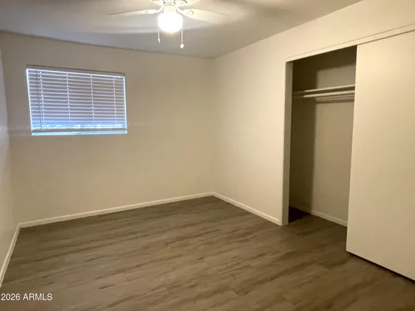 an empty room with wooden floor