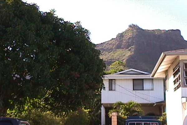 277 Hookipa Road Kapaa, HI 96746 - Photo 2 of 12 a front view of a house with a yard and garage
