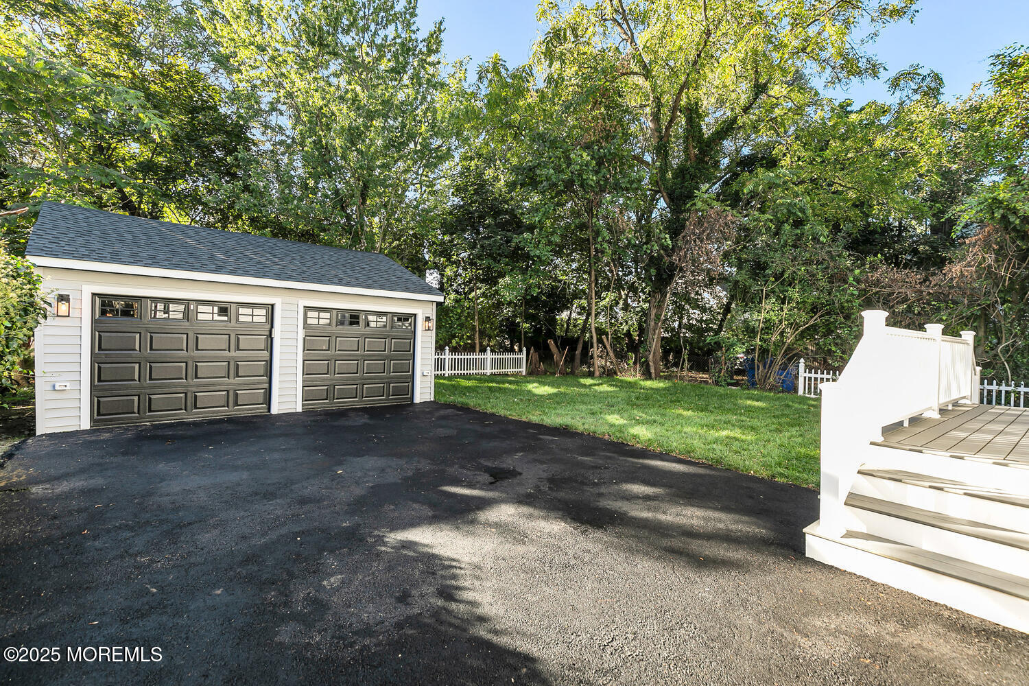 514-516 River Road Fair Haven, NJ 07704 - Photo 40 of 49 a view of a house with a yard and garage
