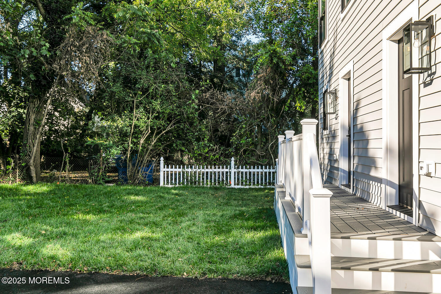 514-516 River Road Fair Haven, NJ 07704 - Photo 41 of 49 a view of a backyard with a plants and trees