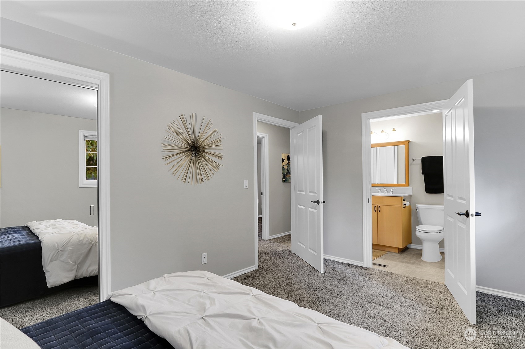 9510 Northeast 201st Street Bothell, WA 98011 - Photo 13 of 22 a bedroom with a bed and a couch