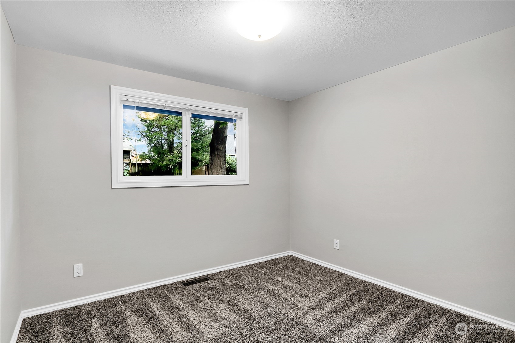 9510 Northeast 201st Street Bothell, WA 98011 - Photo 16 of 22 an empty room with a window
