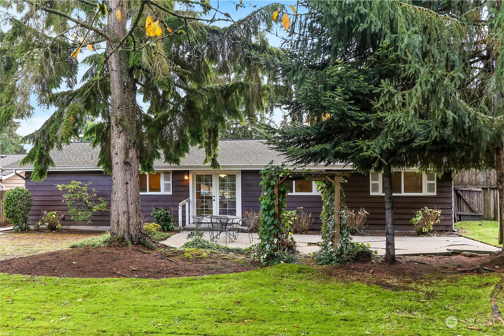 9510 Northeast 201st Street Bothell, WA 98011 - Photo 19 of 22 a view of a house with backyard and a tree