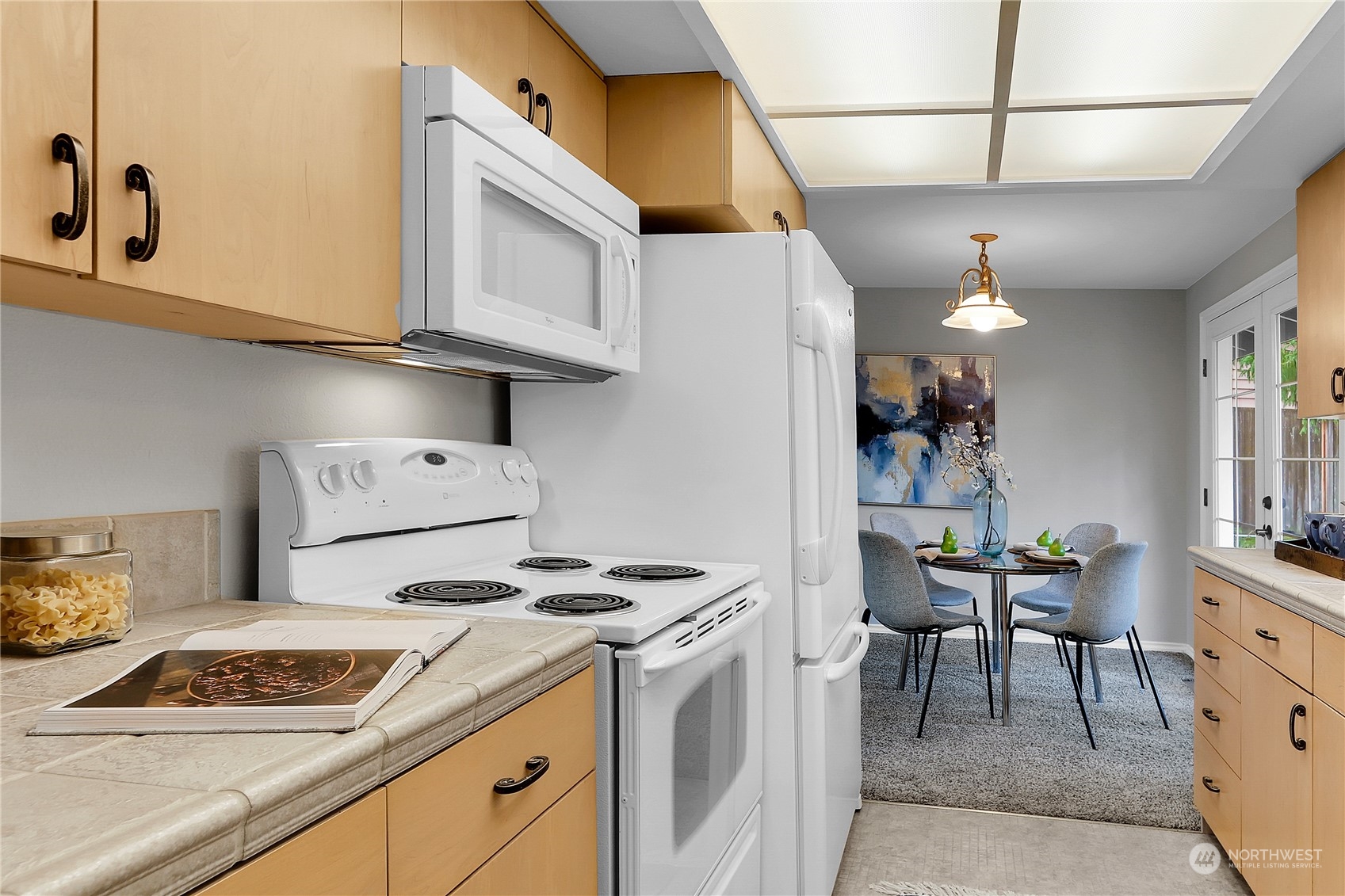 9510 Northeast 201st Street Bothell, WA 98011 - Photo 9 of 22 a kitchen with stainless steel appliances granite countertop a sink stove and cabinets
