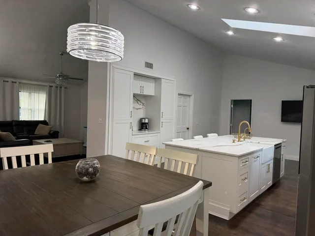 a kitchen with a counter space cabinets and appliances