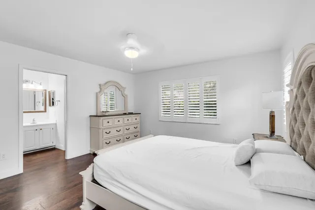 a large white bed in a white room