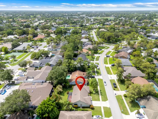 an aerial view of residential houses with outdoor space