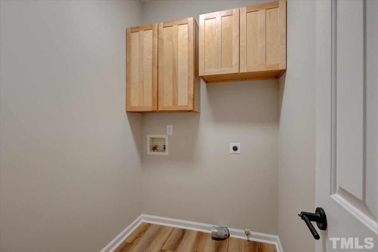 7708 Pinecrest Road Raleigh, NC 27613 - Photo 14 of 29 a bathroom with a sink and a window