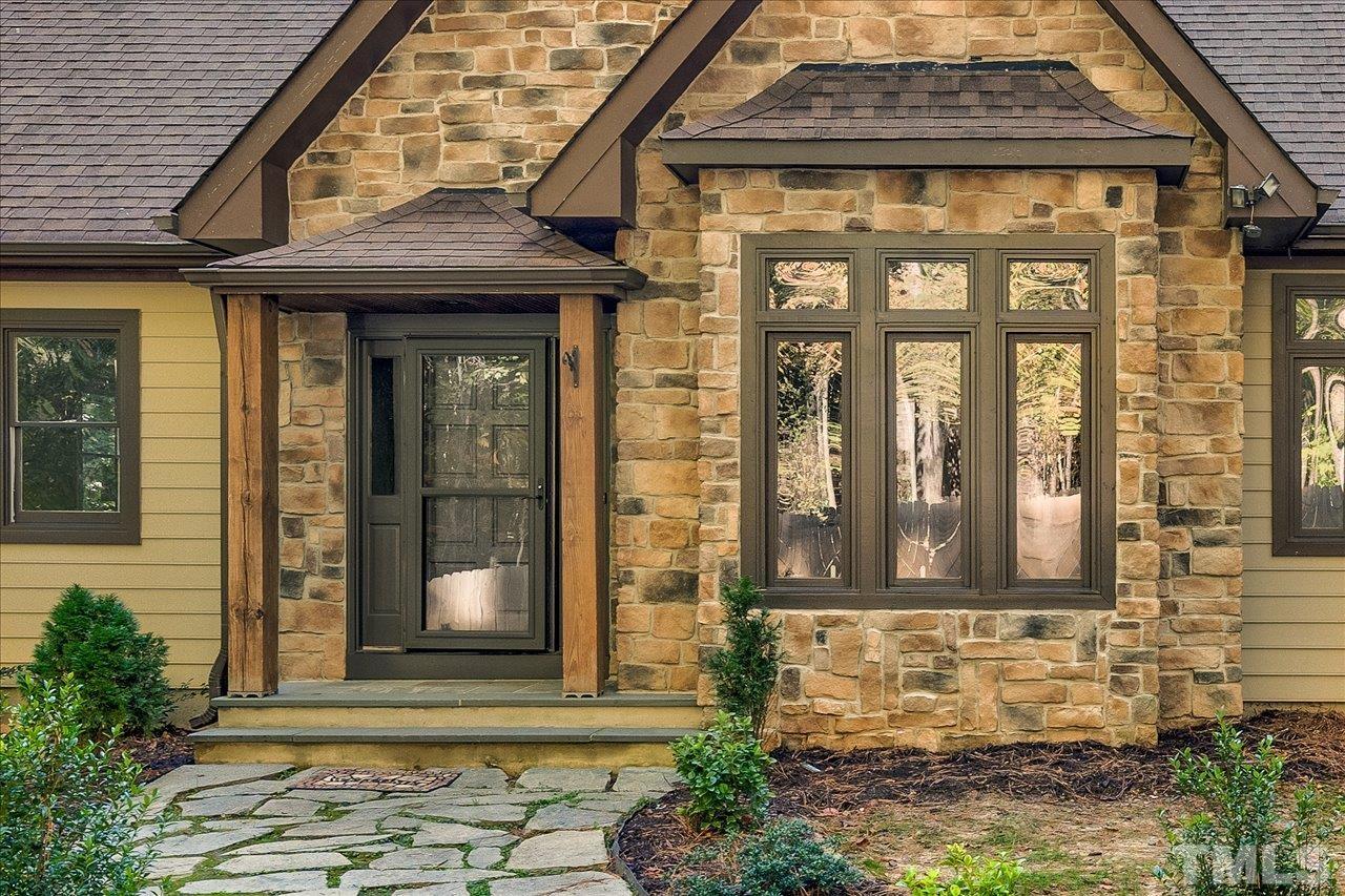 7708 Pinecrest Road Raleigh, NC 27613 - Photo 3 of 29 a front view of a house with a yard
