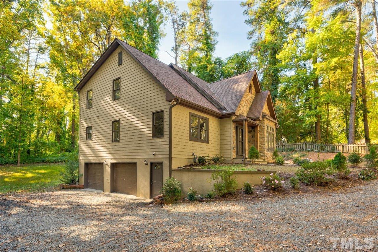 7708 Pinecrest Road Raleigh, NC 27613 - Photo 4 of 29 a view of a house with a yard