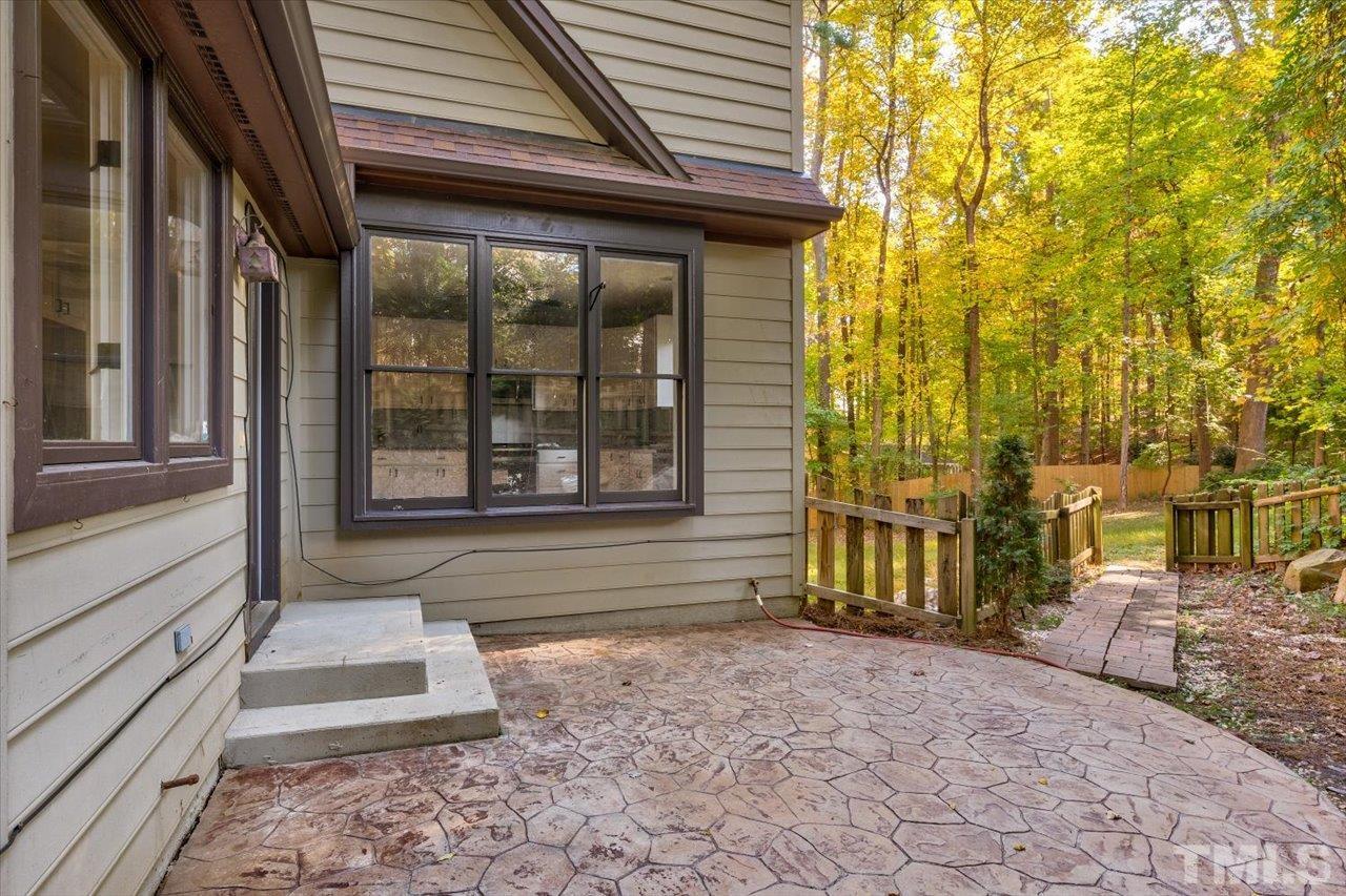 7708 Pinecrest Road Raleigh, NC 27613 - Photo 5 of 29 a view of a pathway of the house