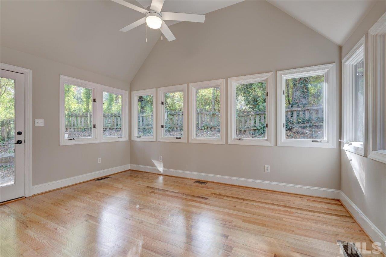 7708 Pinecrest Road Raleigh, NC 27613 - Photo 8 of 29 a view of wooden floor and windows in a room
