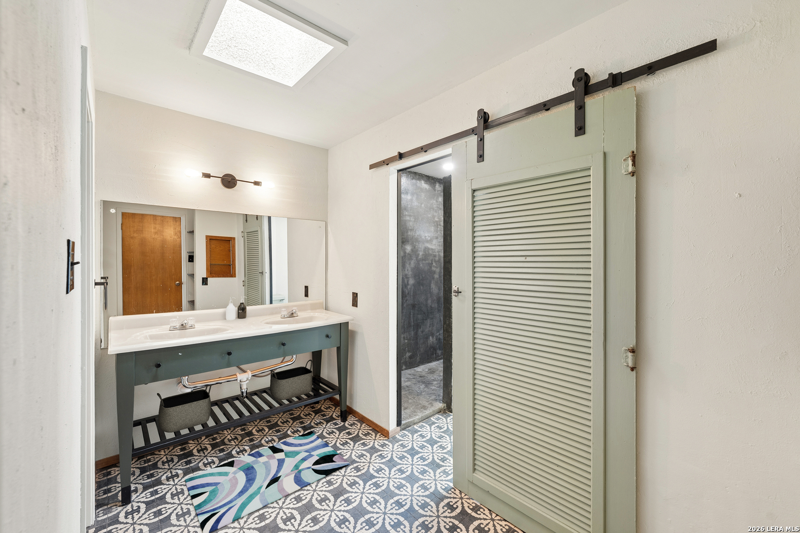 9616 Azalea Circle Garden Ridge, TX 78266 - Photo 12 of 47 a view of a bathroom with a sink and mirror