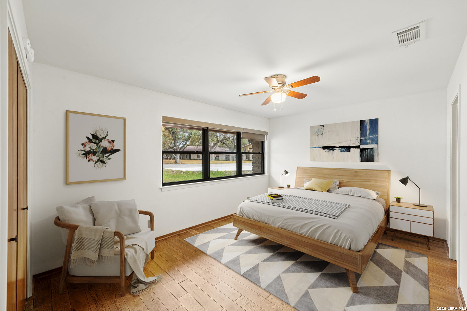 9616 Azalea Circle Garden Ridge, TX 78266 - Photo 15 of 47 a spacious bedroom with a bed and a couch