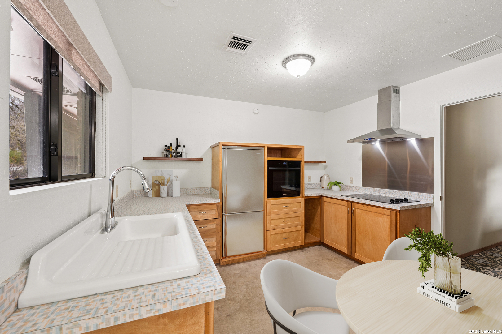 9616 Azalea Circle Garden Ridge, TX 78266 - Photo 18 of 47 a kitchen with stainless steel appliances granite countertop a sink a stove and a refrigerator