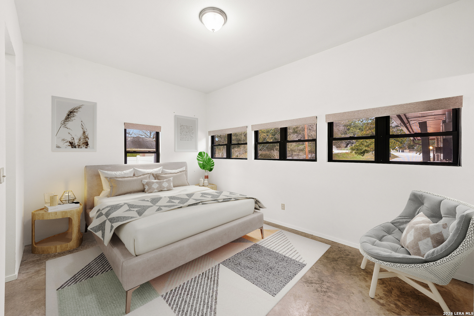 9616 Azalea Circle Garden Ridge, TX 78266 - Photo 20 of 47 a bedroom with a bed a couch and painting on the wall