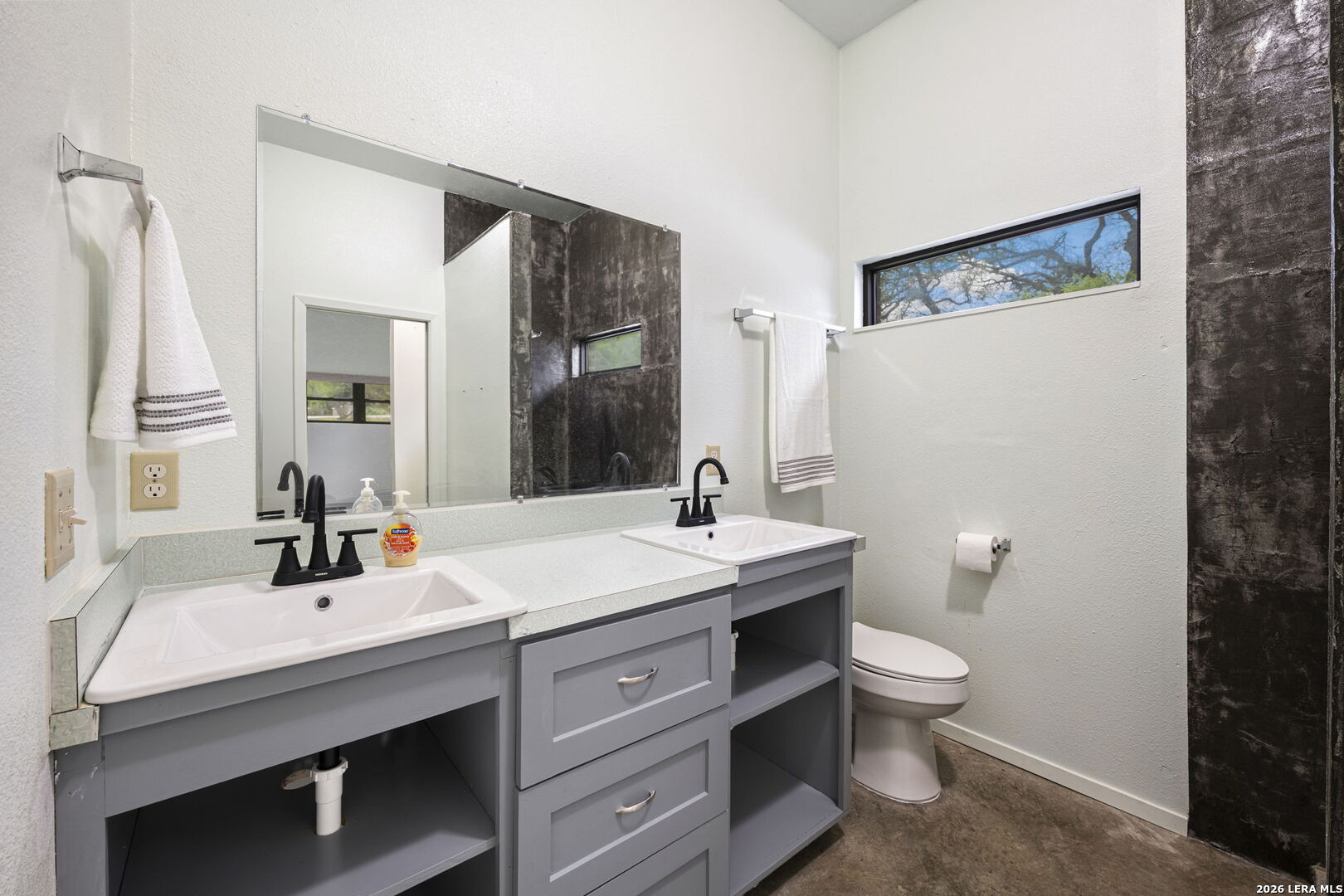9616 Azalea Circle Garden Ridge, TX 78266 - Photo 23 of 47 a bathroom with a sink and a mirror