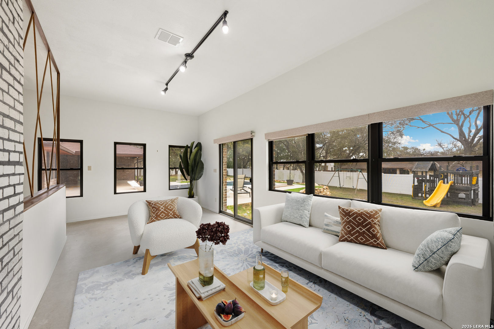 9616 Azalea Circle Garden Ridge, TX 78266 - Photo 25 of 47 a living room with furniture and a large window