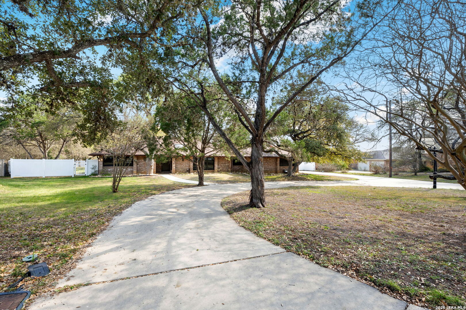 9616 Azalea Circle Garden Ridge, TX 78266 - Photo 26 of 47 a view of a yard with a tree
