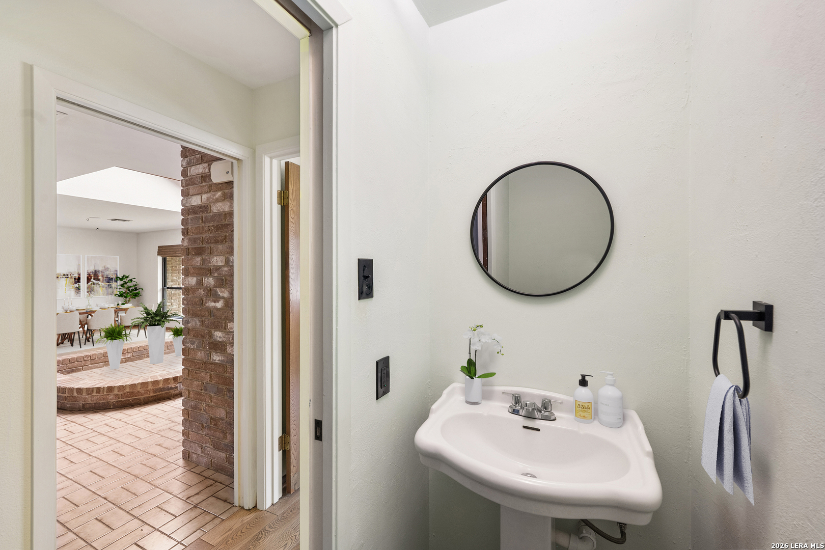 9616 Azalea Circle Garden Ridge, TX 78266 - Photo 36 of 47 a bathroom with a sink and a mirror