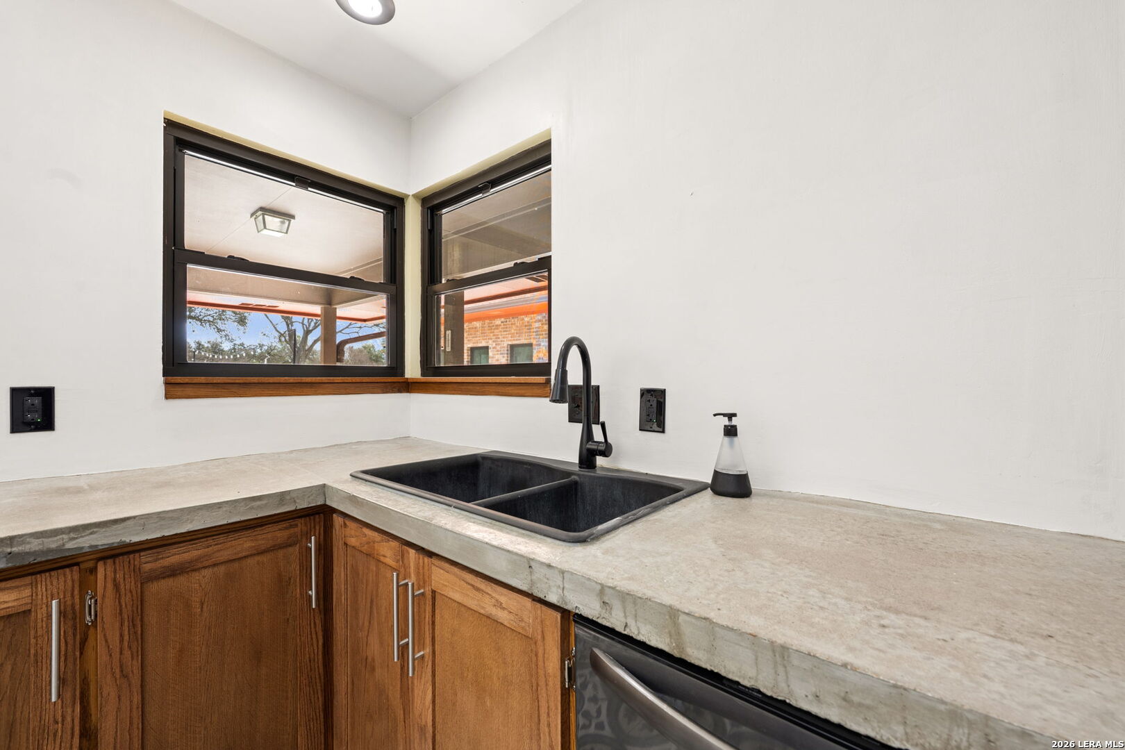 9616 Azalea Circle Garden Ridge, TX 78266 - Photo 41 of 47 a kitchen with a sink and a window