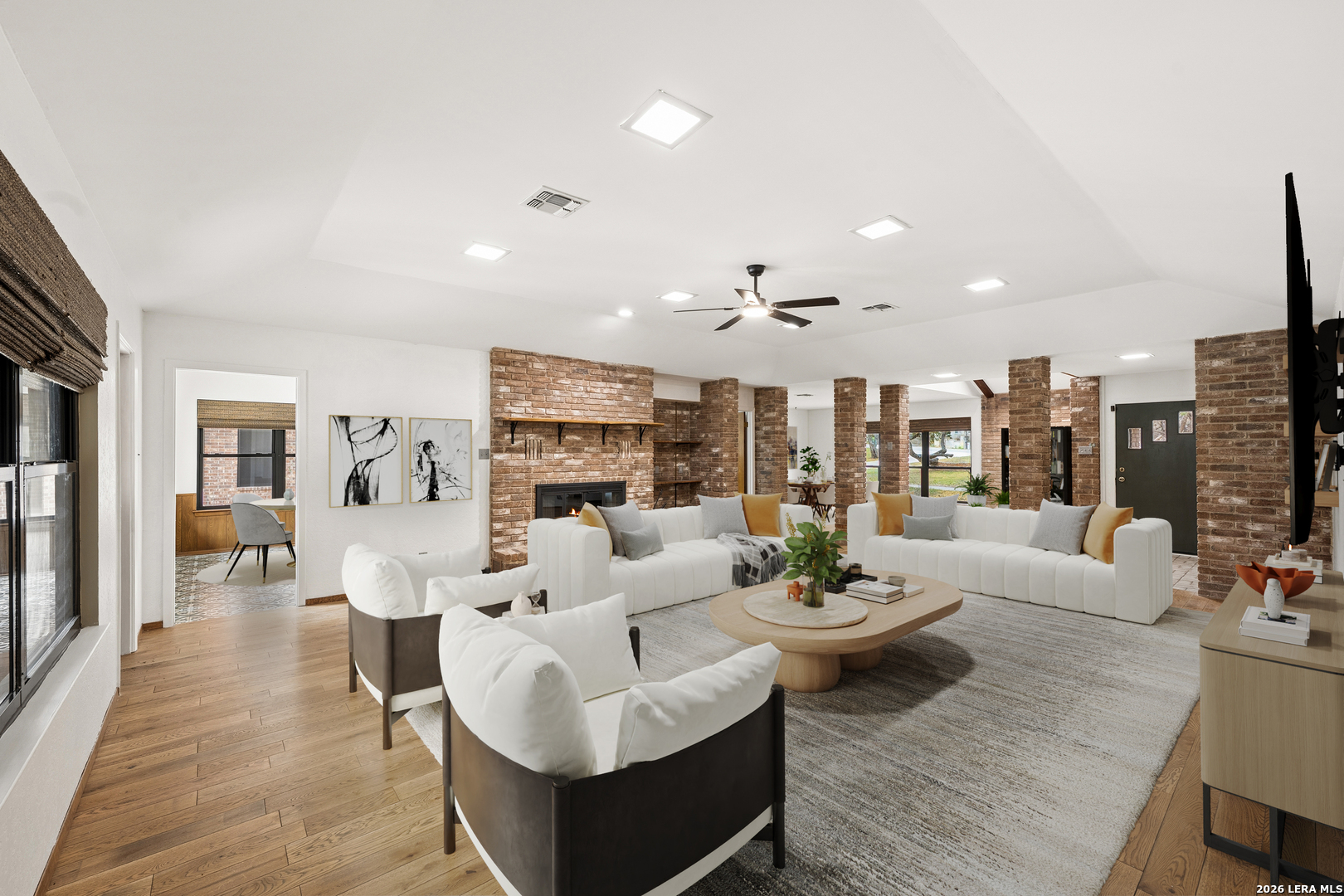 9616 Azalea Circle Garden Ridge, TX 78266 - Photo 6 of 47 a living room with fireplace furniture and a view of kitchen