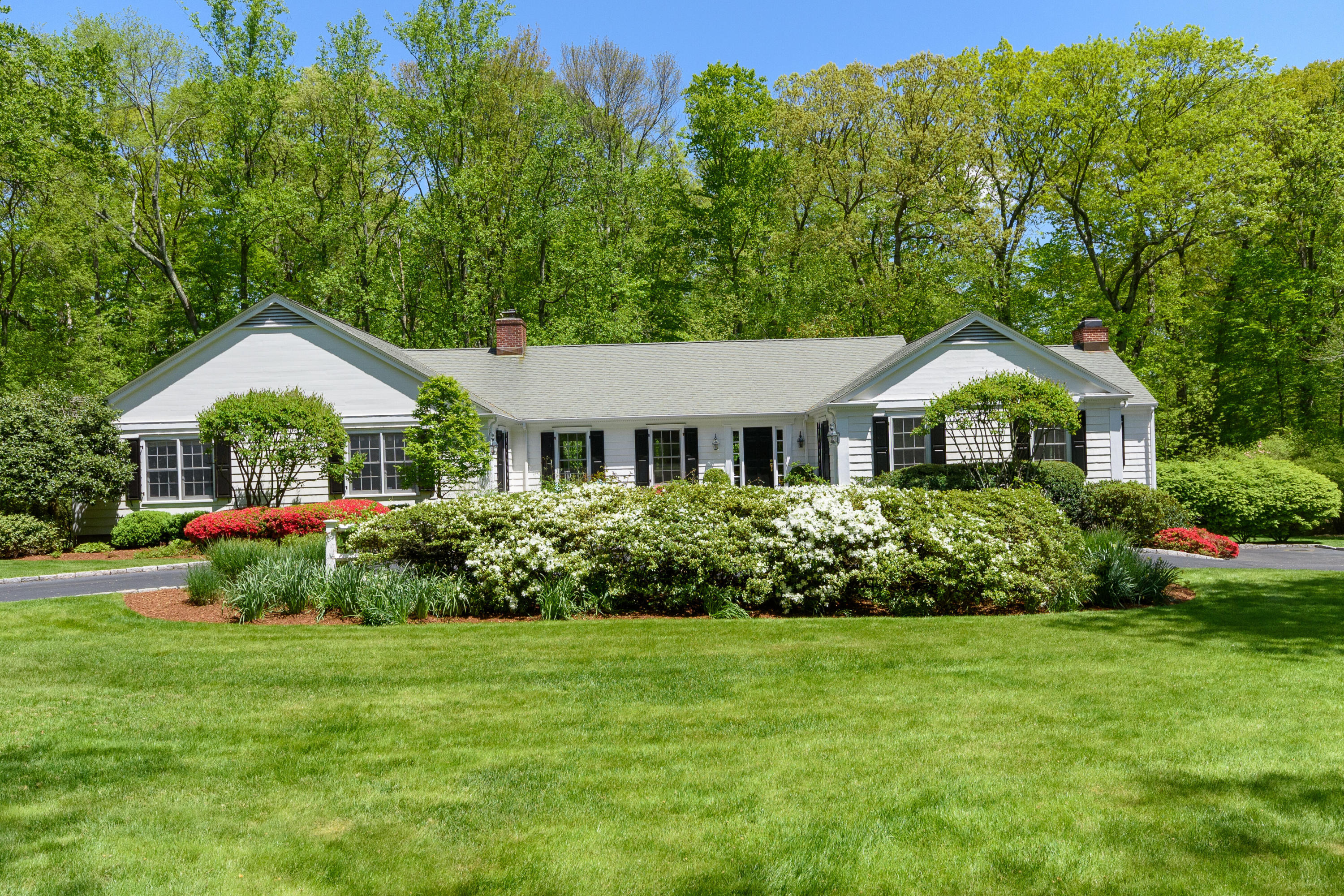 116 Ridge Acres Road Darien, CT 06820 - Photo 1 of 44 a house with green field in front of it