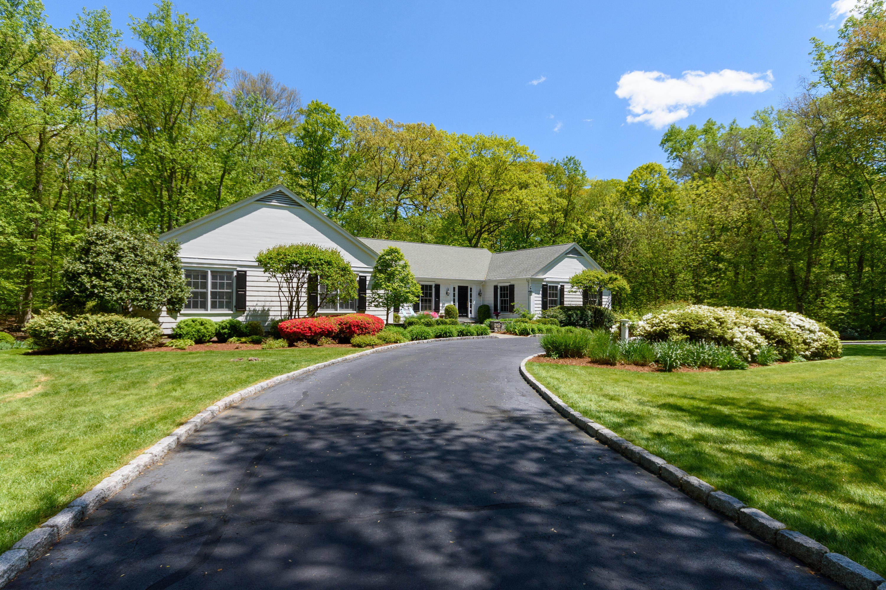 116 Ridge Acres Road Darien, CT 06820 - Photo 2 of 44 a view of house with garden and tall trees