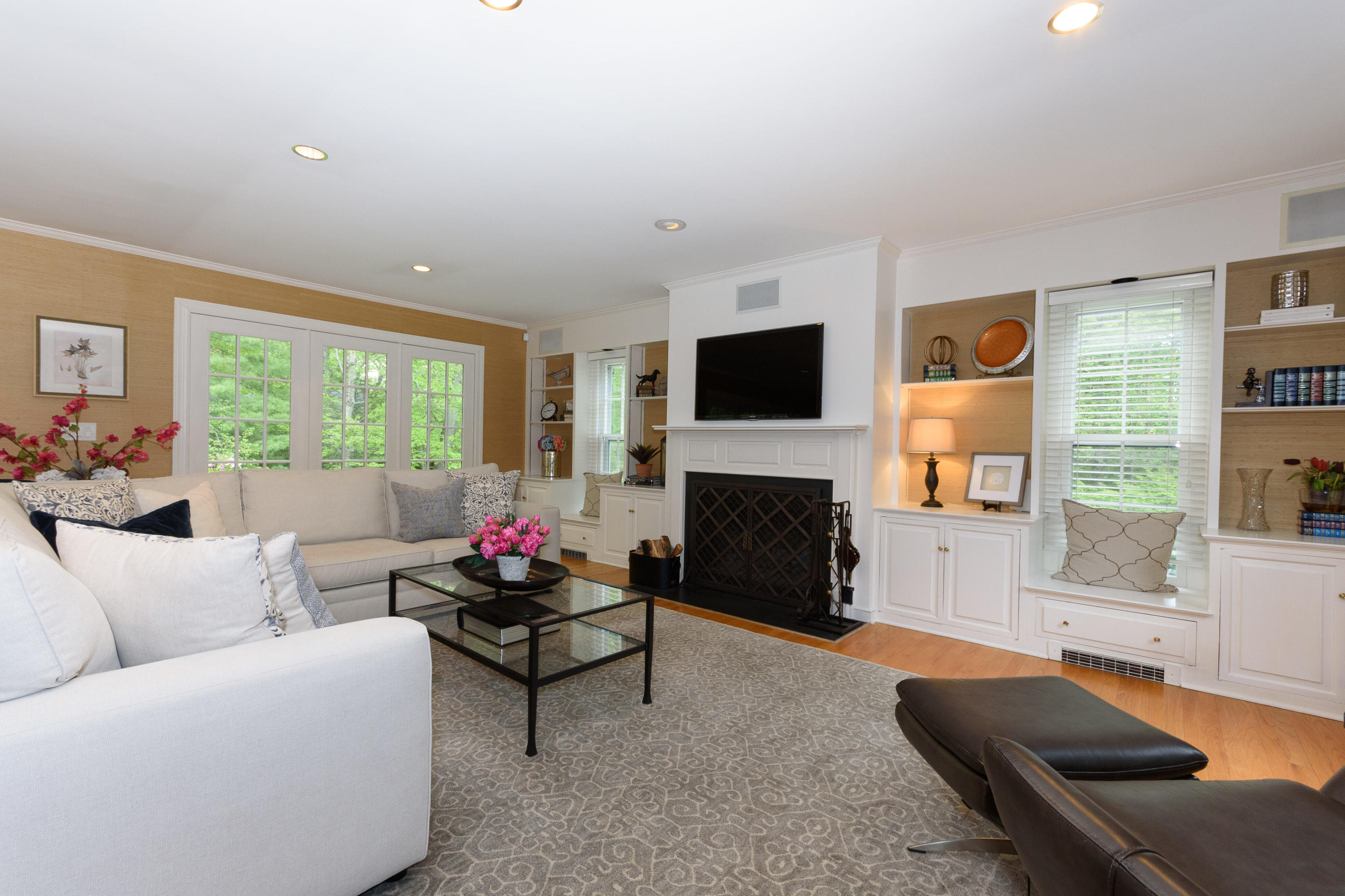 116 Ridge Acres Road Darien, CT 06820 - Photo 14 of 44 a living room with furniture flat screen tv and a fireplace