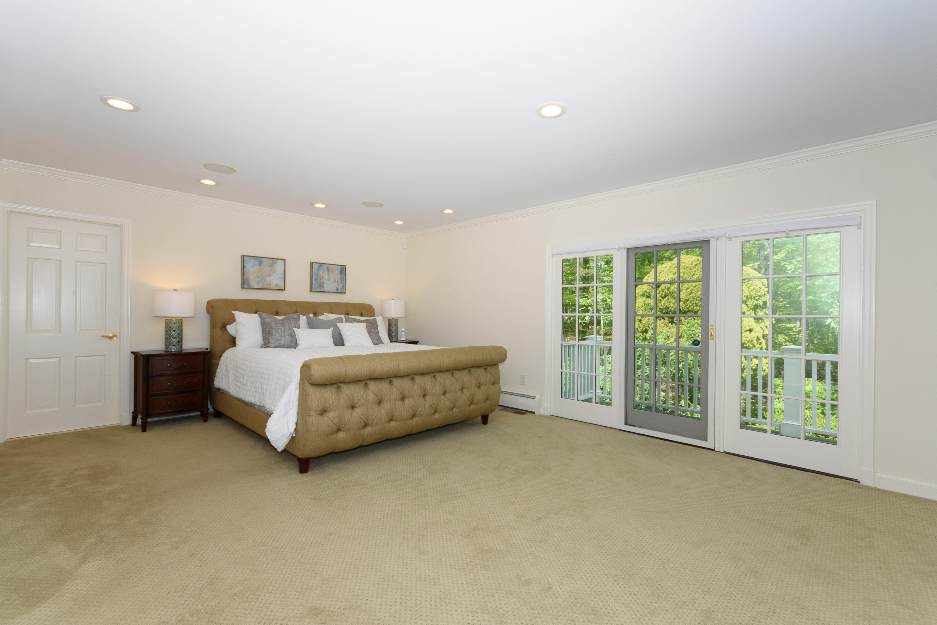 116 Ridge Acres Road Darien, CT 06820 - Photo 19 of 44 a bedroom with a bed and a large window