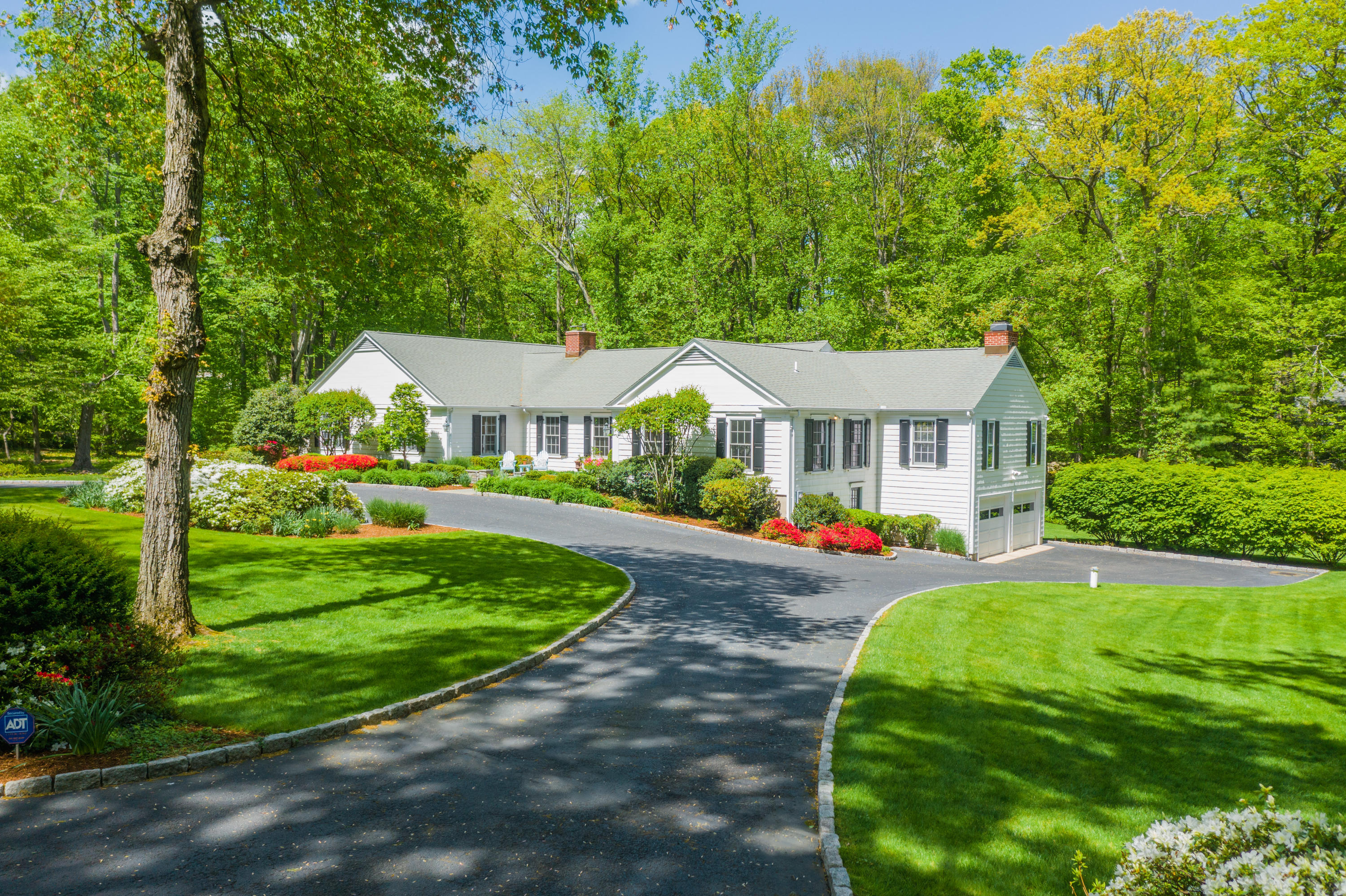 116 Ridge Acres Road Darien, CT 06820 - Photo 3 of 44 a front view of a house with yard and green space