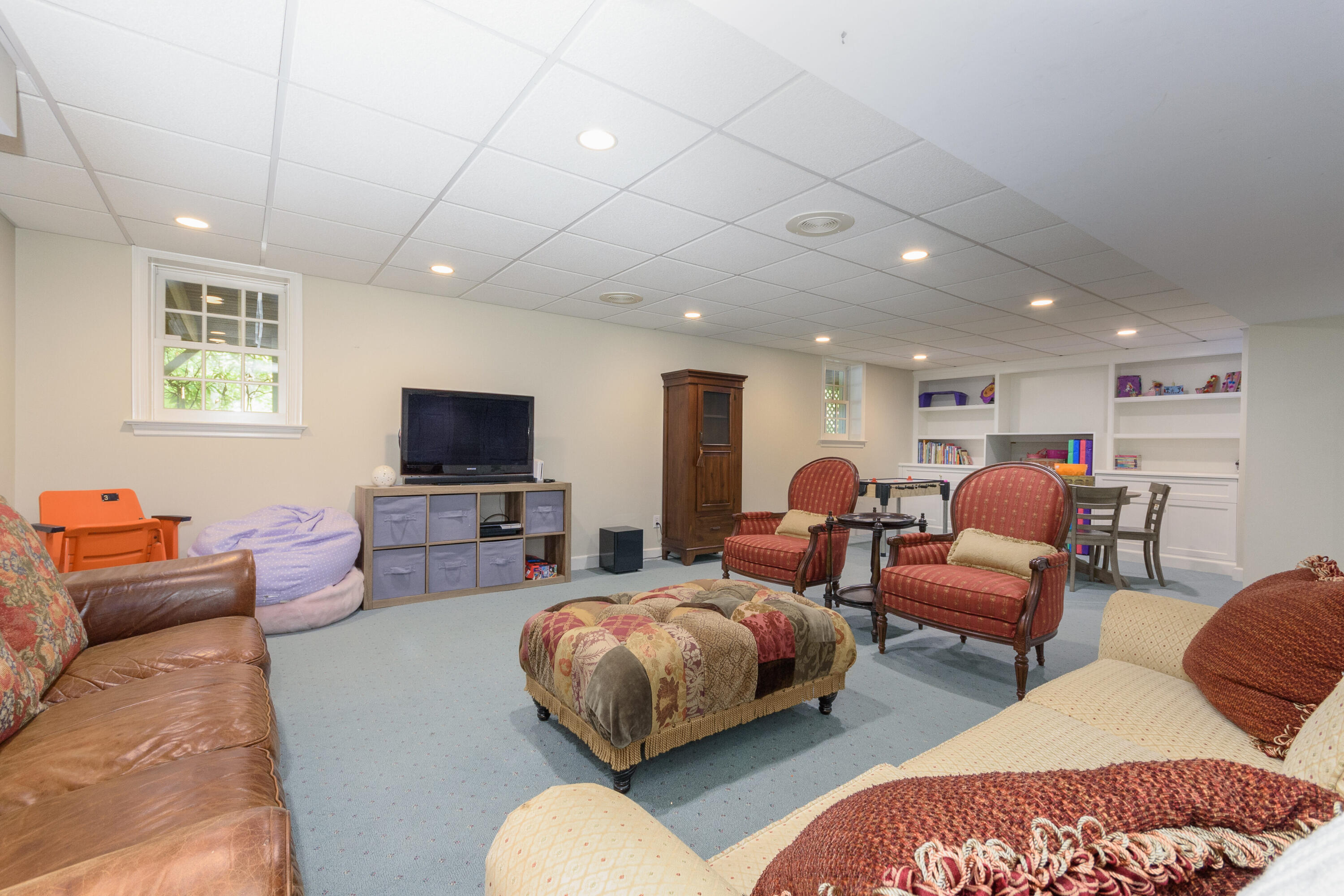116 Ridge Acres Road Darien, CT 06820 - Photo 29 of 44 a living room with furniture a flat screen tv and a window