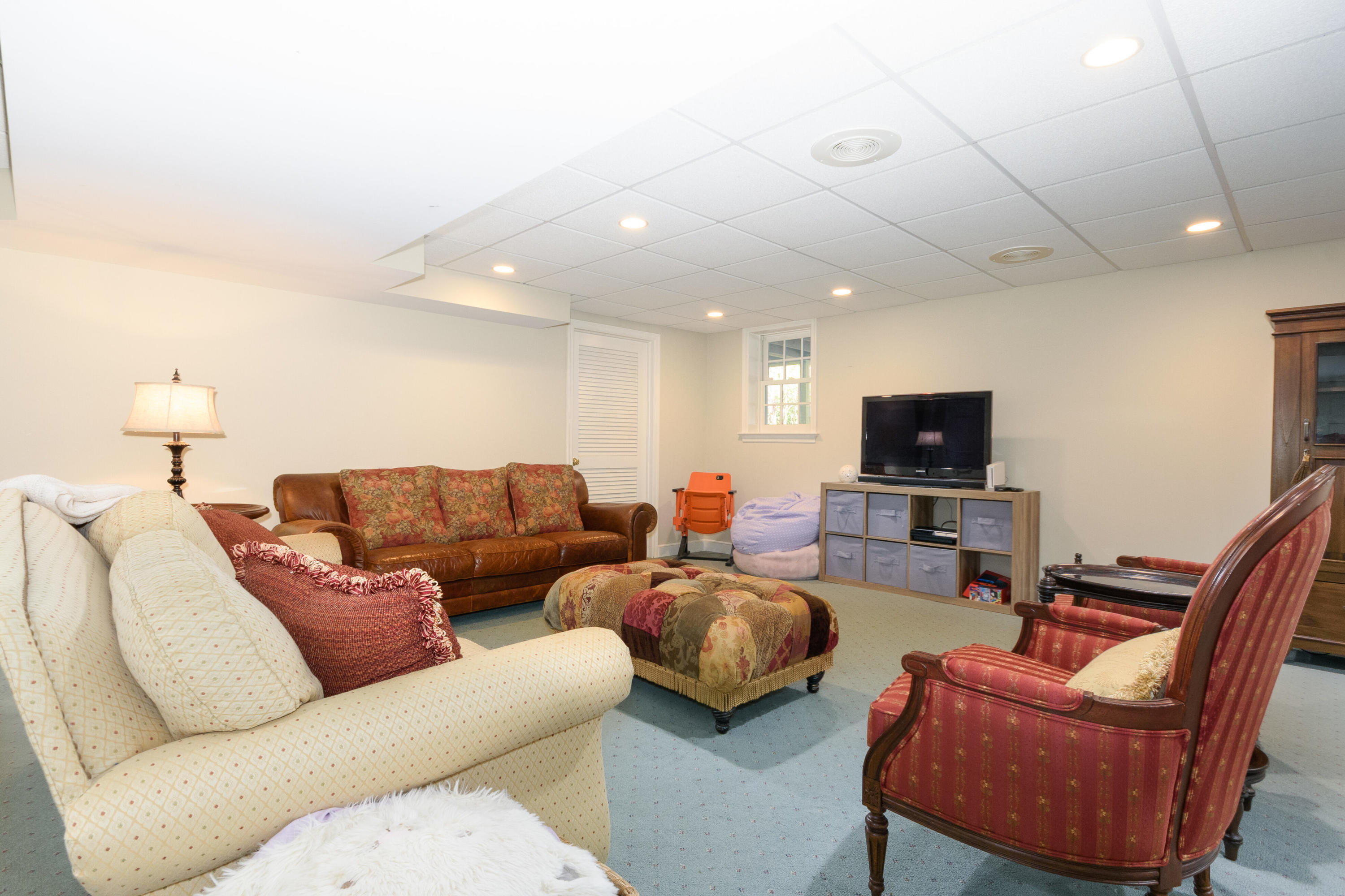 116 Ridge Acres Road Darien, CT 06820 - Photo 30 of 44 a living room with furniture and a flat screen tv