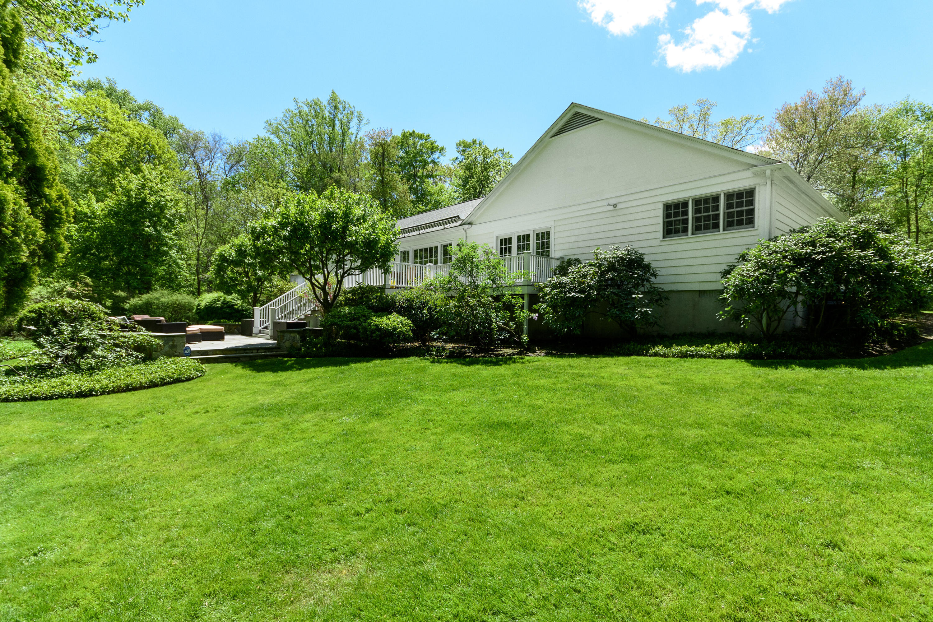 116 Ridge Acres Road Darien, CT 06820 - Photo 34 of 44 a front view of a house with a garden