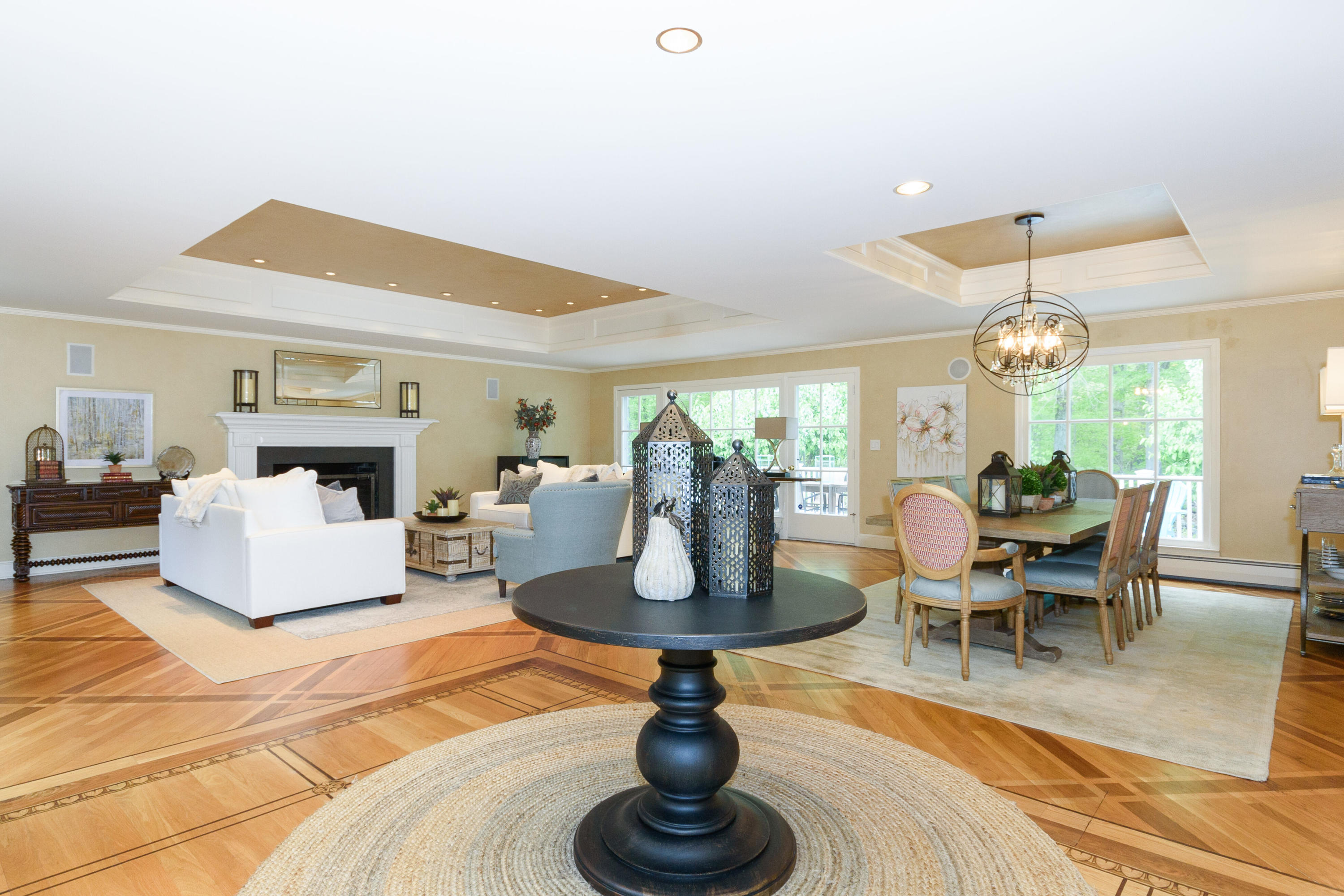 116 Ridge Acres Road Darien, CT 06820 - Photo 5 of 44 a living room with fireplace furniture a rug and a chandelier