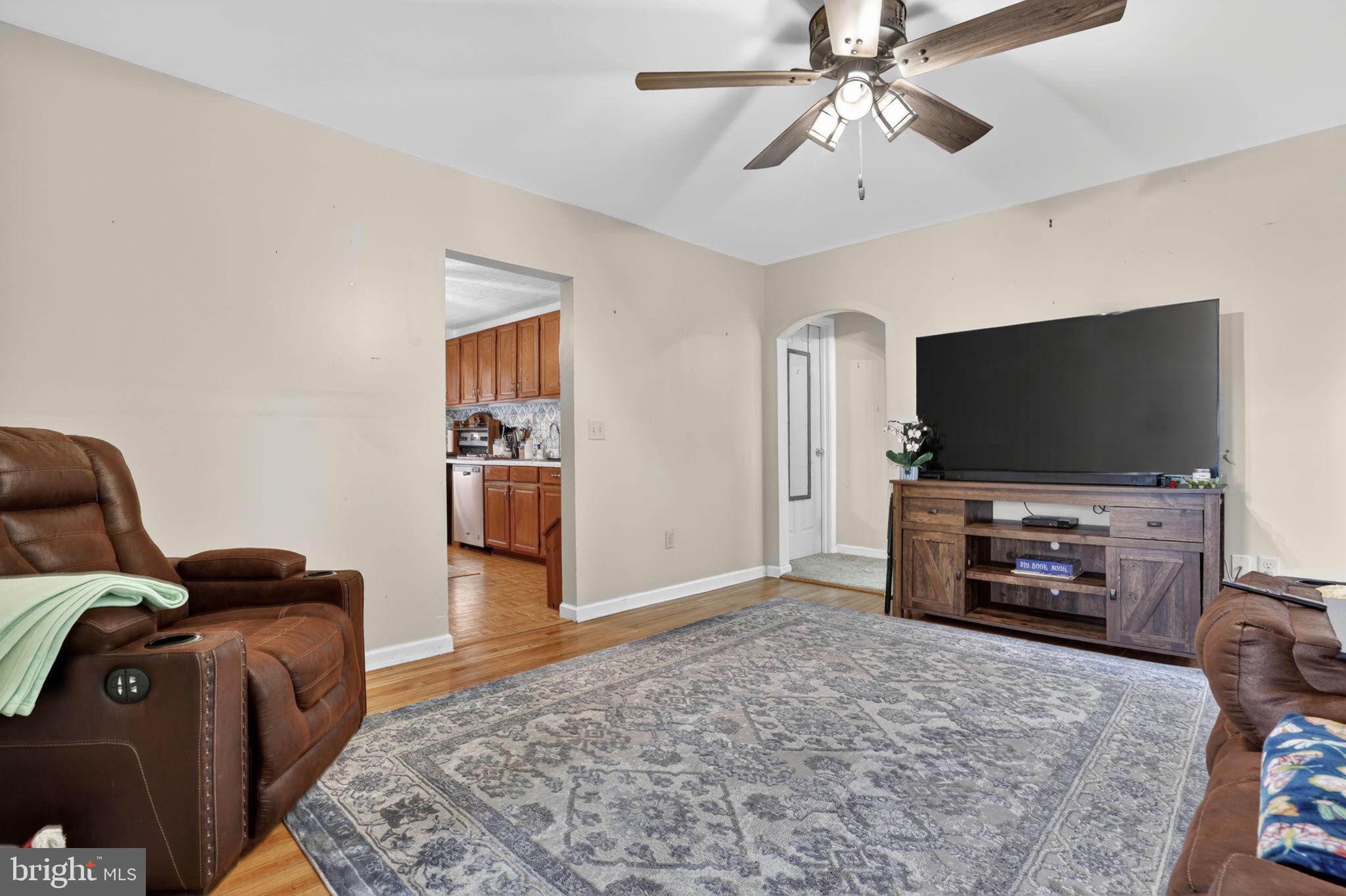 7278 Fleming Road New Church, VA 23415 - Photo 7 of 44 a living room with furniture and a flat screen tv