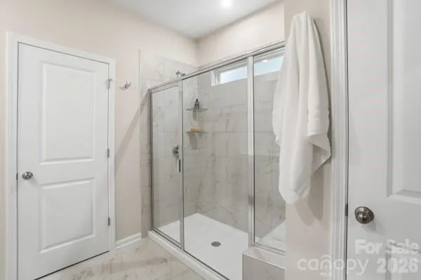 a view of storage and utility room with racks on the wall