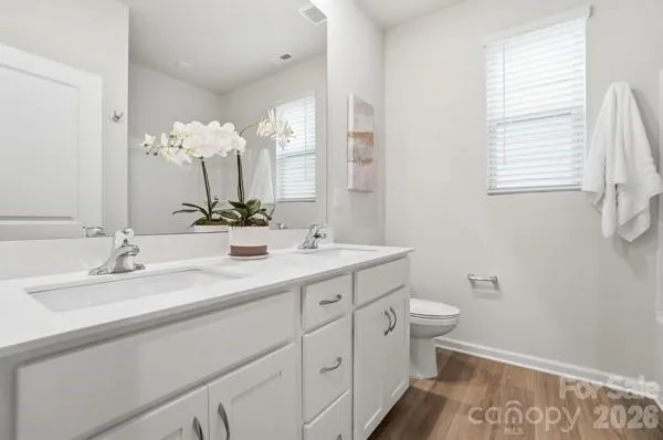 a white bath tub sitting next to a shower