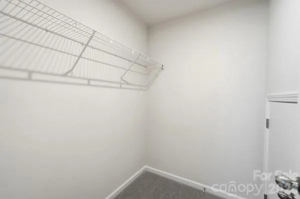 a view of a lake with a house in the background