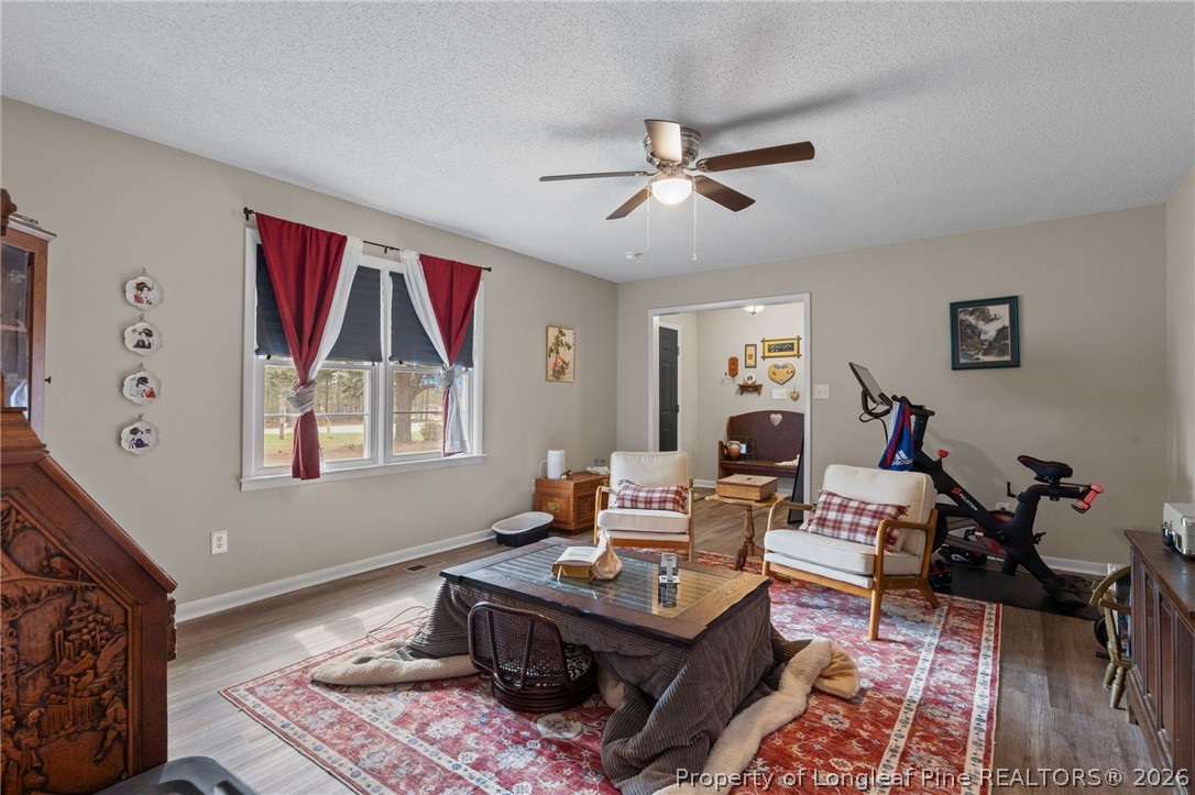 2890 Fulford McMillan Road Raeford, NC 28376 - Photo 17 of 37 a living room with furniture and a window