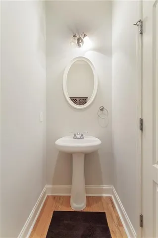a bathroom with a sink a mirror and vanity